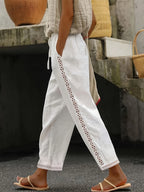 Chic lace patchwork solid ankle pants from 64b136-1e, showing fitted design with lace detail at the ankle and smooth fabric.