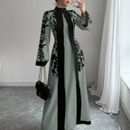 Floral faux two-piece maxi dress by 64b136-1e featuring a flowing skirt and matching top with vibrant floral patterns
