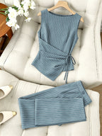 Striped two-piece wide-leg set by 64b136-1e featuring a matching top and pants with bold vertical stripes.