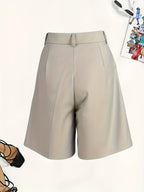 Elegant Bermuda shorts by 64b136-1e, featuring a comfortable fit and stylish design, shown in a casual outdoor setting.