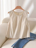 White sleeveless tank top with bow detail and scoop neckline, branded 64b136-1e, casual tops for warm weather.