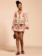Chic holiday print shirt and shorts set from 64b136-1e, featuring vibrant festive patterns on lightweight fabric.