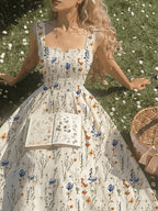 Floral spaghetti strap dress from 64b136-1e, featuring a lightweight fabric with a vibrant floral pattern and adjustable straps.