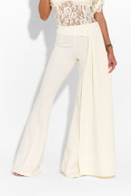 Ivory trousers from MAYFAIR brand, stylish bottoms with a tailored fit, shown on a model in a fashion setting.
