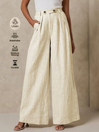 Linen wide-leg pants in a natural color, featuring a relaxed fit and high waist, from brand 64b136-1e.