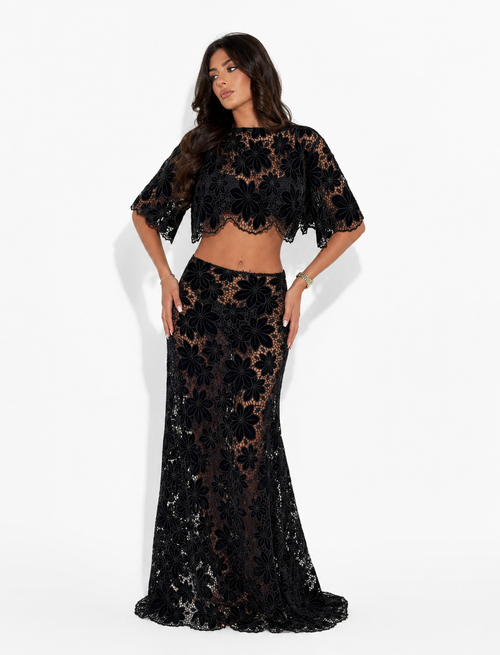Black Amira floral maxi skirt from 64b136-1e bottoms collection, featuring a flowing, floral-patterned design.