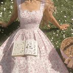Floral spaghetti strap dress from 64b136-1e, featuring a vibrant floral pattern and lightweight fabric, ideal for summer wear.