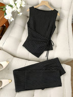 Striped two-piece wide-leg set from 64b136-1e featuring a relaxed fit, with a matching top and pants in a modern design.