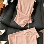 Striped two-piece wide-leg set by 64b136-1e, featuring a matching top and pants with bold stripe pattern on lightweight fabric.