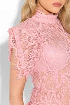 Pink lace dress from the Victoria collection, featuring elegant detailing and a flattering fit, perfect for special occasions.