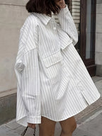 Oversized long sleeve shirt from 64b136-1e featuring a relaxed fit, soft fabric, and classic design in a neutral color.