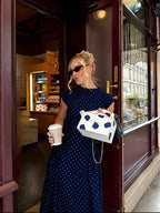 Polka dot French maxi dress by 64b136-1e with flowing fabric and a fitted waist, featuring a classic pattern and elegant design.