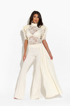 Ivory trousers from the MAYFAIR collection by 64b136-1e, shown on a model, featuring a tailored fit and classic style.