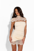 KENSINGTON lace dress displayed on a hanger, featuring intricate lace details and a classic silhouette for elegant occasions.