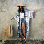 Printed loose kimono cardigan from 64b136-1e, featuring lightweight fabric, long sleeves, and a relaxed fit for casual style.