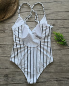Colorful one-piece swimsuit by 64b136-1e featuring a sleek design, perfect for swimwear and beachwear in multiple vibrant colors.