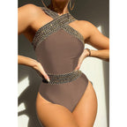 Colorful detailed one-piece swimwear by 64b136-1e featuring multiple styles and vibrant colors, displayed on a mannequin.