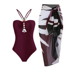 64b136-1e one-piece retro swimwear with matching skirt in various prints, featuring colorful patterns and classic design.