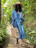 Printed loose kimono cardigan from 64b136-1e, featuring lightweight fabric, long sleeves, and a relaxed fit.