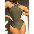 Colorful one-piece swimwear by 64b136-1e featuring intricate design and multiple style options, displayed on a model.