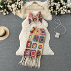 Two-piece knitted beach set by 64b136-1e featuring a cropped top and matching skirt in soft knitted fabric.