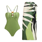 64b136-1e retro one-piece swimwear with matching skirt in various prints, featuring a stylish vintage-inspired design.