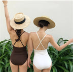 Black one-piece push-up swimsuit by 64b136-1e featuring a sleek design and supportive fit, perfect for beach or poolside wear.
