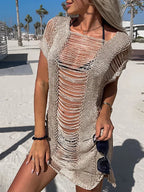 Colorful knit beach style mini dress from 64b136-1e featuring a casual, sleeveless design perfect for summer outings.