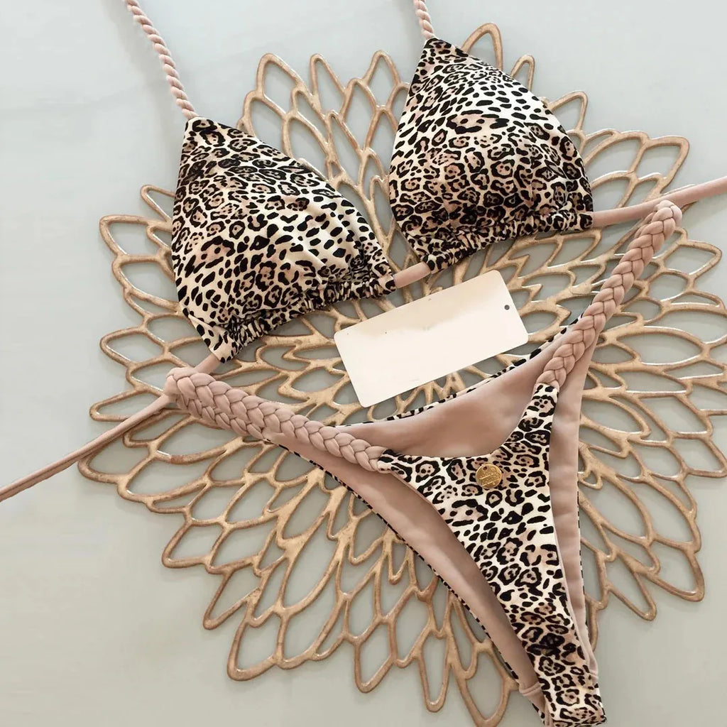 Leopard print bikini swimwear by 64b136-1e, featuring a stylish animal print design on the bikini top and bottoms.