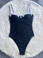 Push-up bikini swimwear by 64b136-1e featuring a stylish 2-piece or one-piece bathing suit with supportive design.