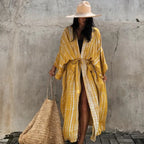 Printed loose kimono cardigan from 64b136-1e, showing lightweight fabric, wide sleeves, and a relaxed fit in vibrant print.