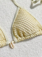 Three-piece bikini set in four colors, stylish swimwear by 64b136-1e, featuring a top and bottom with matching accessories.