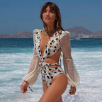 Gray one-piece sleeved swimsuit by 64b136-1e, featuring full coverage and a sleek, modern design for swimwear enthusiasts.