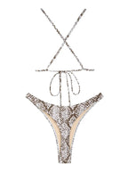Criss cross snake print thong bikini swimwear featuring a stylish pattern and minimal coverage, designed for beach or poolside wear.