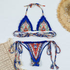Dark blue lace boho cross bandage bikini set, stylish swimwear with intricate lace details and adjustable straps.