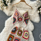 Two-piece knitted beach set by 64b136-1e featuring a crop top and shorts in soft, stretchy knit fabric.