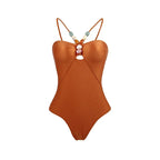 Retro one-piece swimwear with matching skirt in various prints by 64b136-1e, shown in a stylish, colorful design.