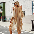 See-through tassel bikini beach cover-up from 64b136-1e, lightweight swimwear with tassel details, perfect for beach or poolside.