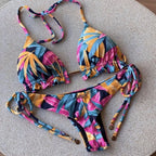 Boho tassel bottom bikini by 64b136-1e featuring colorful prints and string ties, perfect for beach or poolside wear.