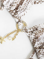 Criss cross snake print thong bikini swimwear with stylish design, featuring a snake pattern and minimal coverage for beachwear.