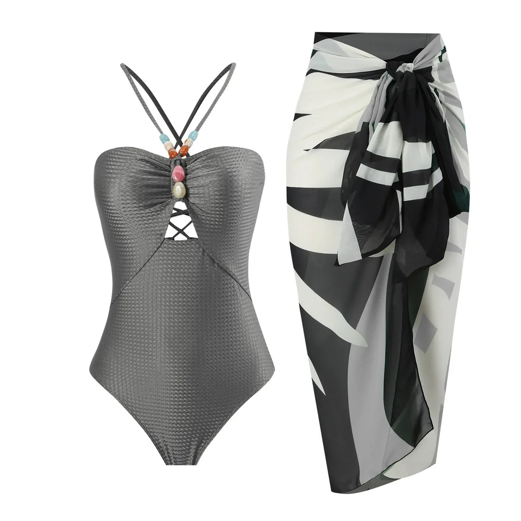 Colorful one-piece retro swimwear with matching skirt from 64b136-1e, featuring multiple vibrant prints and a classic fit.
