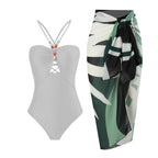 Retro one-piece swimwear with matching skirt in various prints by 64b136-1e, featuring colorful, vintage-inspired design.