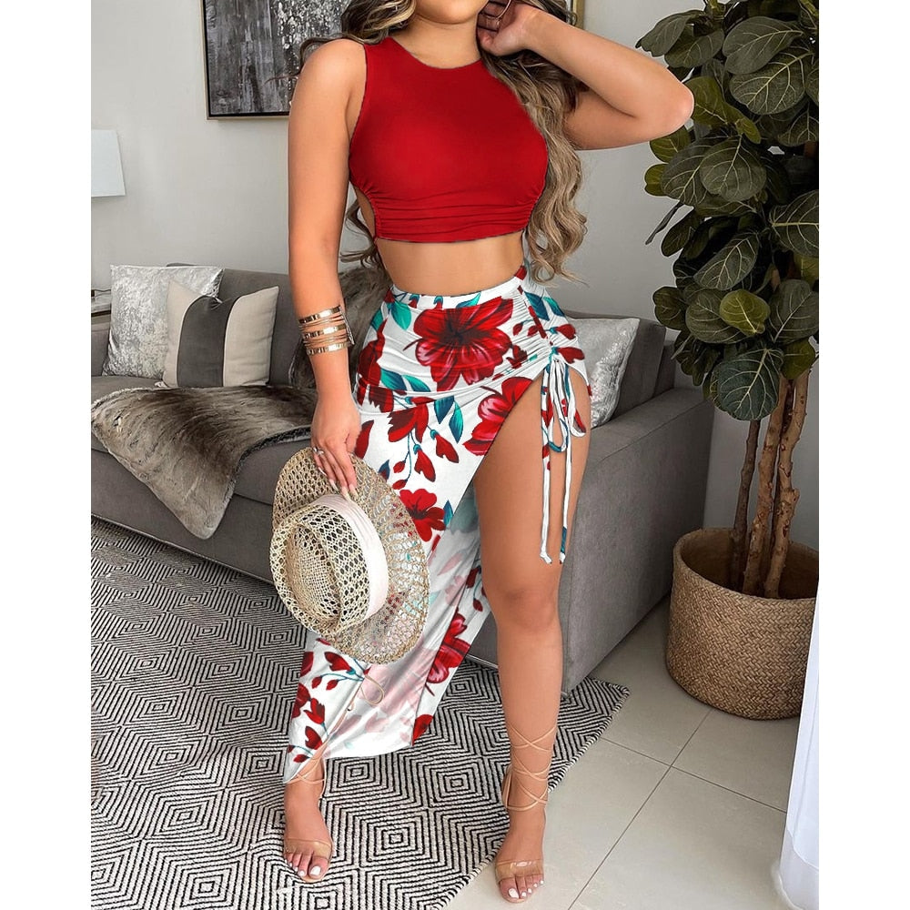 Two-piece crop top and drawstring skirt set in multiple prints by 64b136-1e, featuring stylish, coordinated fashion for casual wear.
