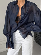Sheer bell sleeve loose shirt from 64b136-1e, featuring flowy fabric and stylish bell sleeves, ideal for casual or dressy wear.