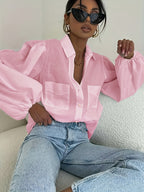 Light beige semi-sheer button-up summer top from 64b136-1e, featuring a relaxed fit and elegant semi-sheer fabric.