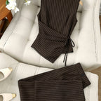 Striped two-piece wide-leg set by 64b136-1e featuring matching top and pants with bold vertical stripes.