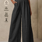 Light beige linen wide-leg pants by 64b136-1e, featuring a relaxed fit and flowing fabric perfect for casual or summer wear.