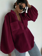 Elegant semi-sheer button-up summer top from 64b136-1e, featuring lightweight fabric and stylish design.