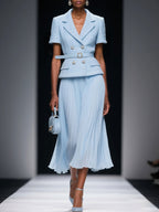 64b136-1e waistcoat and pleated skirt set featuring a fitted waistcoat and flowing pleated skirt in stylish fabric.