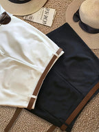 Three-piece shorts set from 64b136-1e featuring casual shorts, tank top, and matching accessories for a stylish summer look.